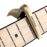 Kapodaster do ukulele Ortega OCAPOUKE-BRB złoty brushed brass, banjo mandolina